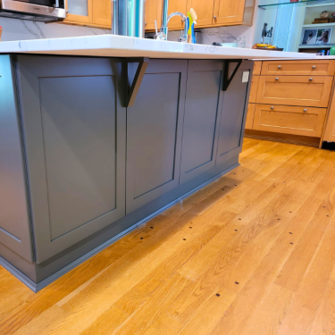 Gray Kitchen Island With Custom Details In Contemporary Home